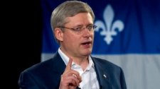 Prime Minister Stephen Harper delivers a speech during a campaign rally in Saint-Agapit Quebec on Tuesday, April 5, 2011. (Sean Kilpatrick / THE CANADIAN PRESS)