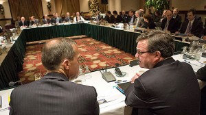Federal Finance Minister Jim Flaherty, right, speaks to Bank of Canada governor Mark Carney prior to to a provincial, territorial and federal finance ministers meeting in Victoria Monday.