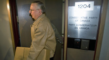 An Elections Canada official removes a box of files from Conservative Party headquarters in Ottawa on April 15, 2008. - An Elections Canada official removes a box of files from Conservative Party headquarters in Ottawa on April 15, 2008. | Tom Hanson/The Canadian Press