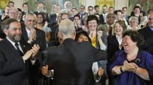 NDP Leader Jack Layton hugs his wife, Toronto MP Olivia Chow, after speaking to his caucus in Ottawa on May 24, 2011.